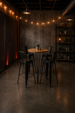 Industrial high cocktail table with four black metal bar stools in a modern event lounge setup for UAE event rentals