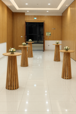 Maxwell round wooden high tables with tapered slatted bases for event rental in Dubai