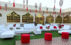 Red Round Pouffe, White Sofa